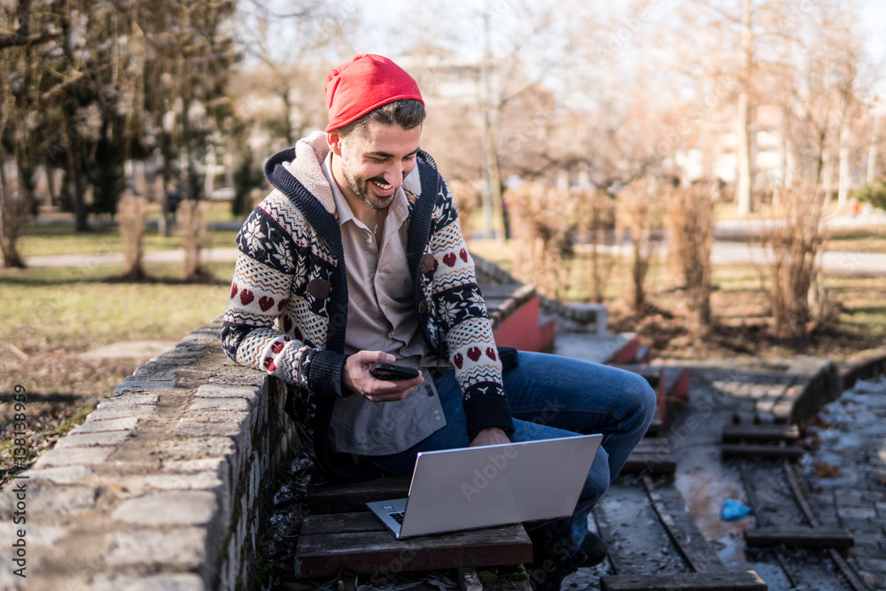 Young Man With Laptop Working 