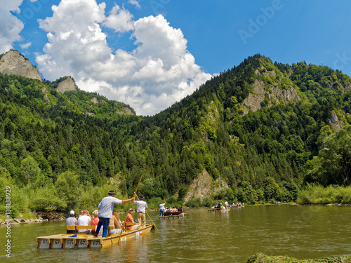 Rafting on river with traditional wooden boats