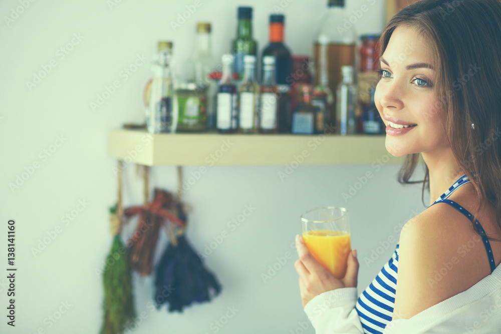 Portrait of a pretty woman holding glass with tasty juice Portrait of a pretty woman holding glass with tasty juice
