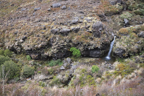 Fototapet Waterfall in Mordor below Mount Doom (Mount Ngaunuhoe) Walkway at Tongariro Alpi