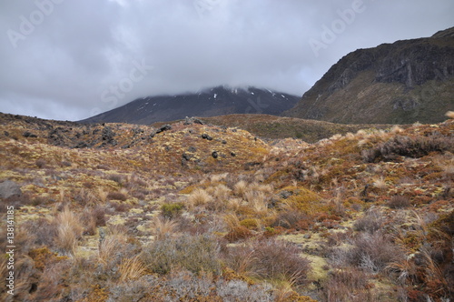 Leinwand Poster Mount Doom in clouds at Mordor (Mount Ngaunuhoe) Walkway at Tongariro Alpine Cro