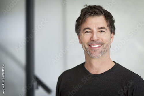 Portrait Of A Mature Man Smiling At The Camera. Home