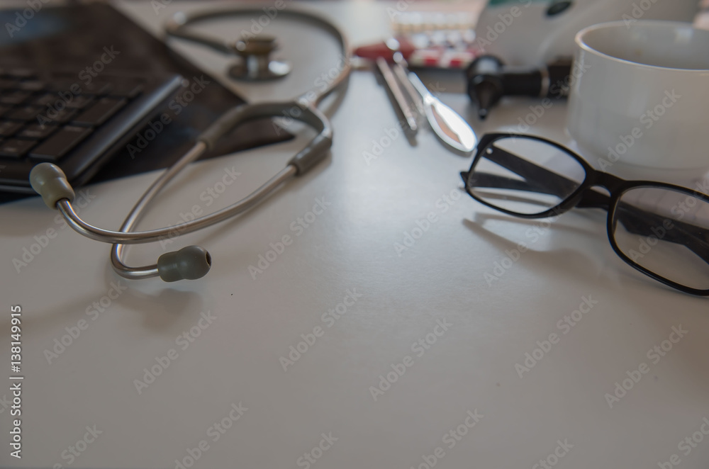 stethoscope and Medical equipment , film x-ray, cup coffee. Doctor workplace in office . stethoscope and Medical equipment , film x-ray, cup coffee. Doctor workplace in office .