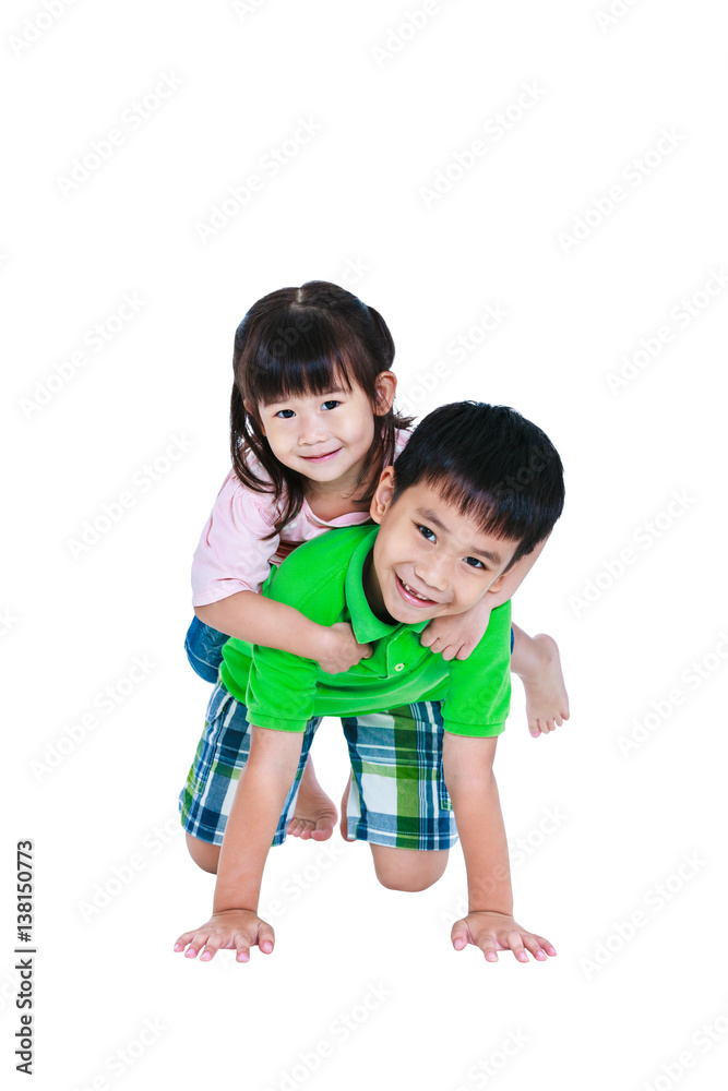 Asian kindly brother hugging his sister smiling happy together, isolated on white background. Asian kindly brother hugging his sister smiling happy together, isolated on white background.