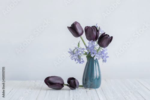 flowers in vase on white background