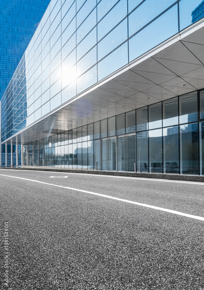 empty asphalt road along modern business buildings in city of China. empty asphalt road along modern business buildings in city of China.