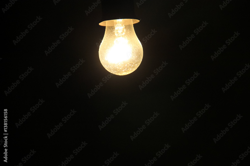 Electric light bulb on a dark background