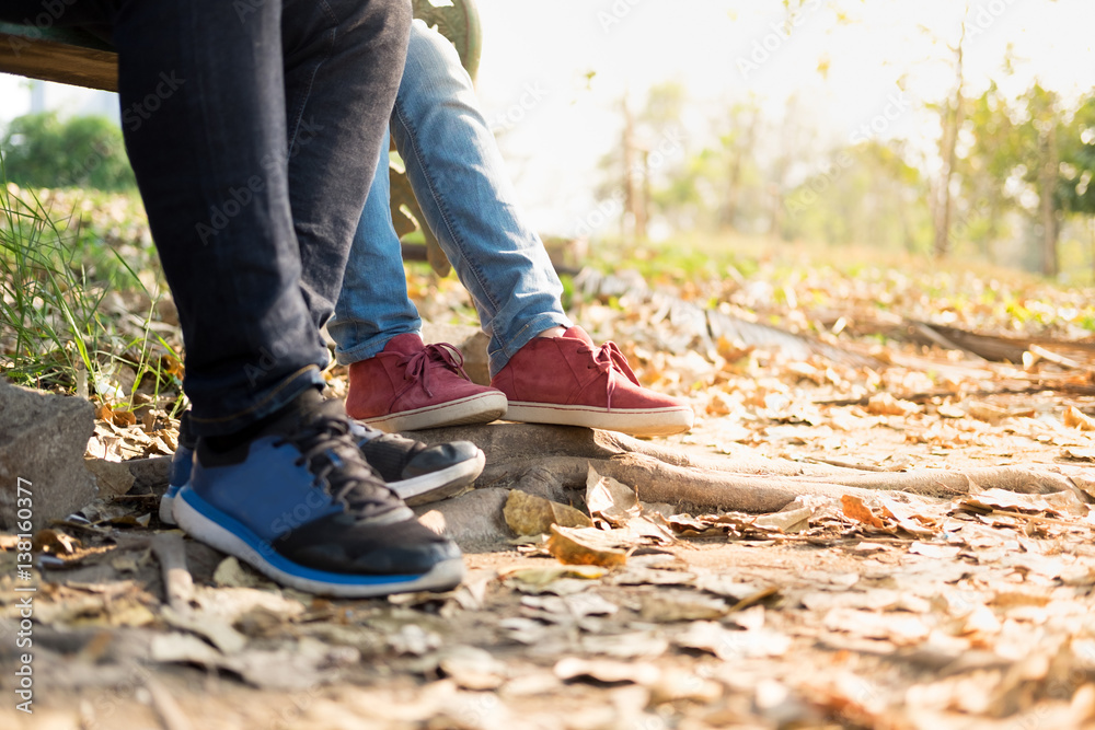 focus woman wearing  red shoes with blue jean