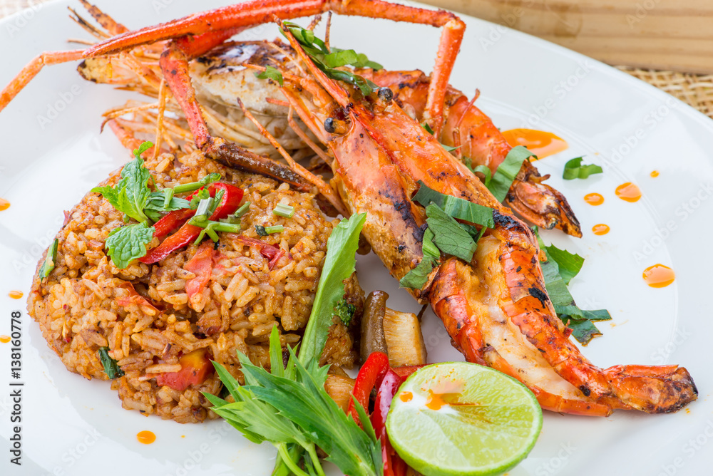 Asian fried rice nasi goreng with chicken, prawns, egg and vegetables, Thai cuisine