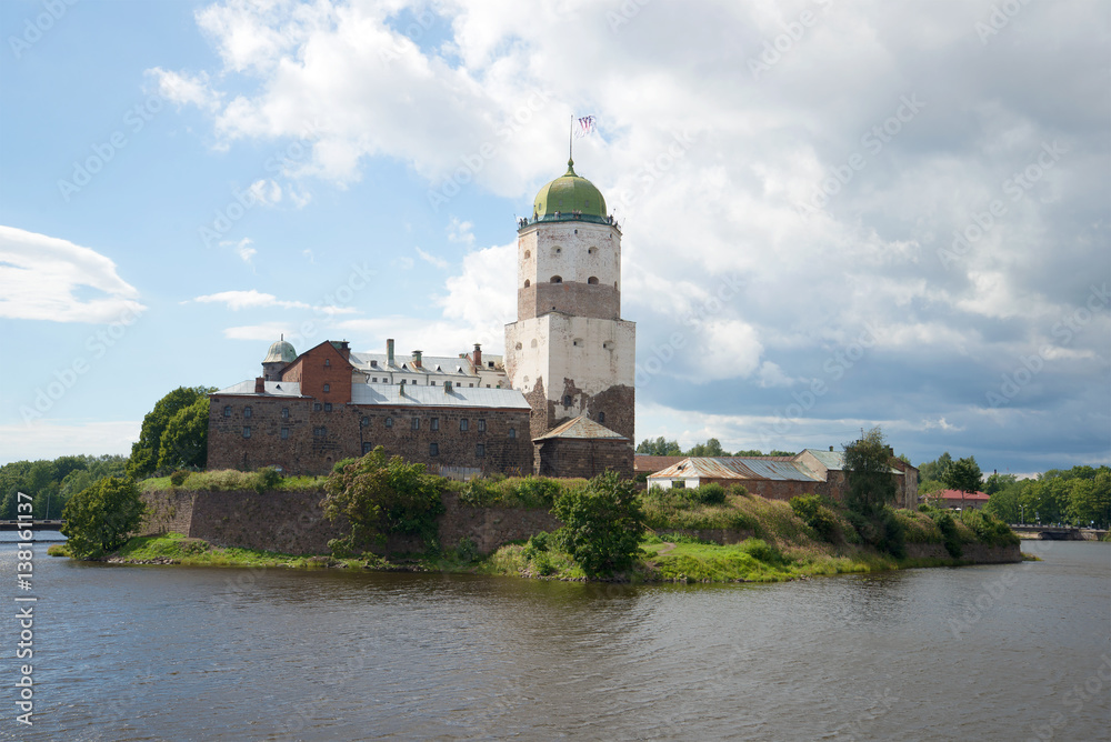 View of the medieval Vyborg Castle in the cloudy August afternoon. Vyborg, Russia