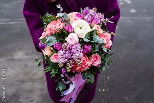 Woman holding beautiful bouquet of flowers photo
