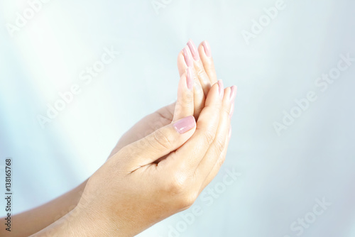 close up of beautiful Asian woman hands with both palms facing up.