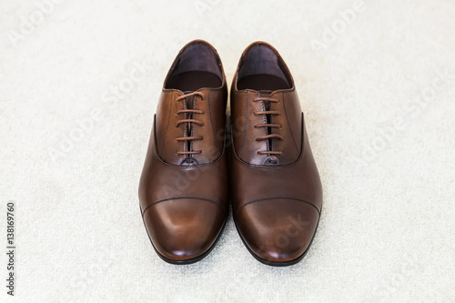 Brown leather men's shoes. Groom accessories.