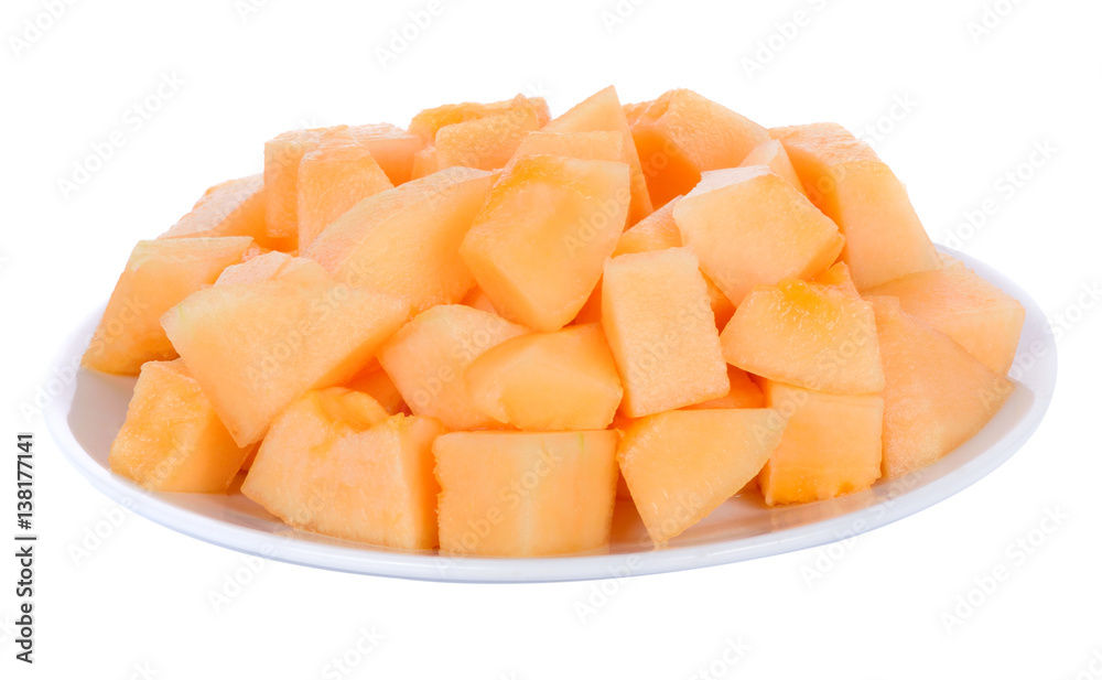 Cantalope melon slice in white plate isolated on white background