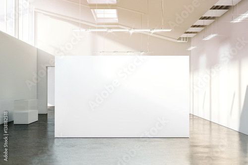 Blank white wall mockup in sunny modern empty museum, 3d rendering. Clear big stand mock up in gallery with contemporary art exhibitions. Large hall interior with wide banner exposition template. photo
