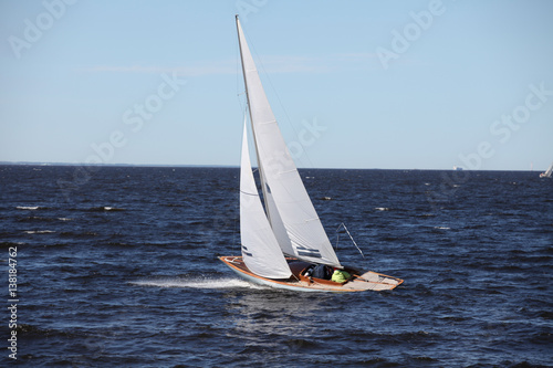 classic yacht with white sails in the sea in motion