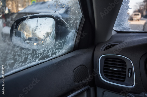 Droplets and snowflakes on car window © greentellect