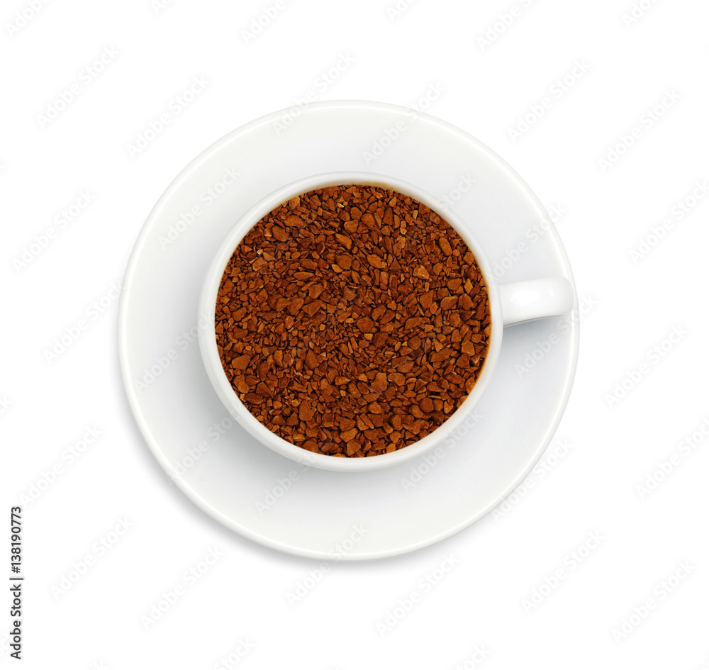 granules of instant coffee in a white cup granules of instant coffee in a white cup