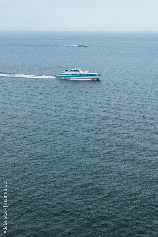 Two ships sailing in the sea. Two ships sailing in the sea.