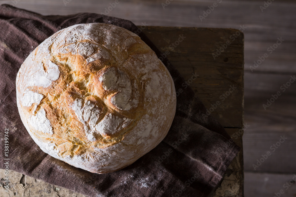 Freshly baked traditional bread on wooden table Freshly baked traditional bread on wooden table
