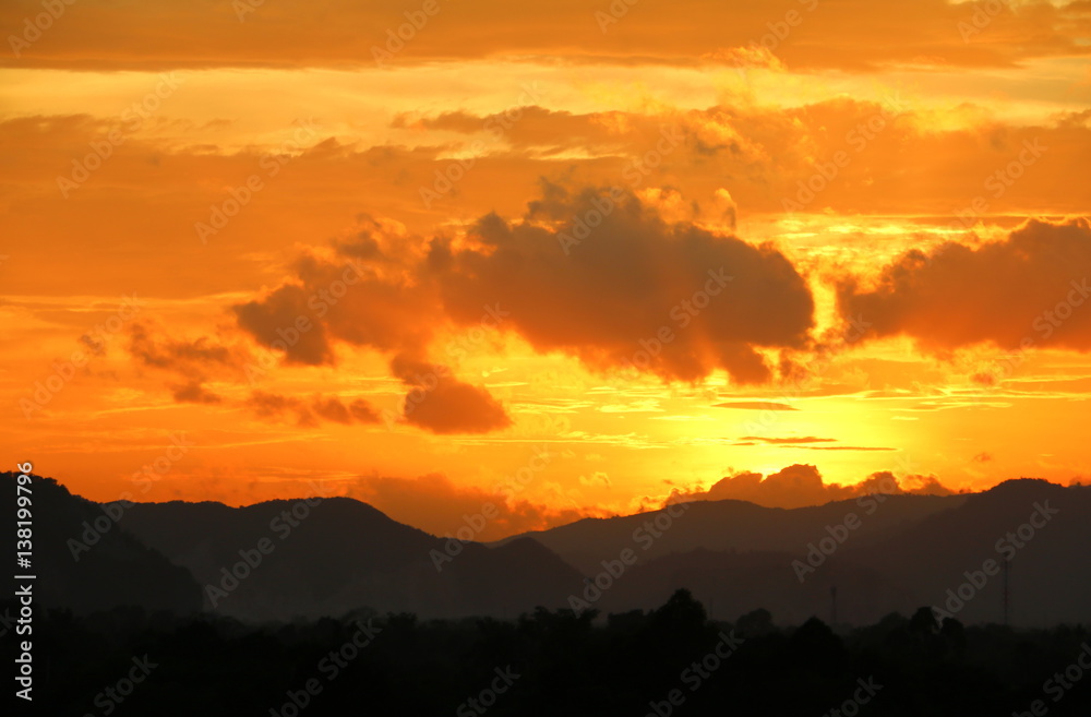 sky in sunset  and motion cloud,  beautiful colorful  twilight  time with mountain silhouette