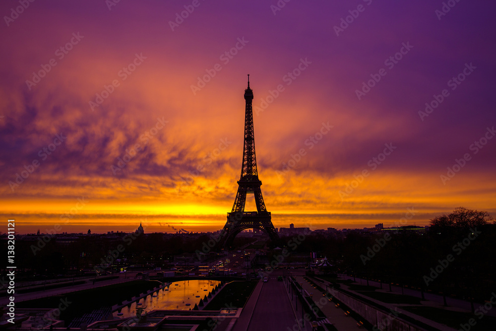 Awesome incredible pink-orange-lilac sunrise. View of the Eiffel Tower from the Trocadero.Beautiful cityscape in backlit morning sunbeam. Paris. France.