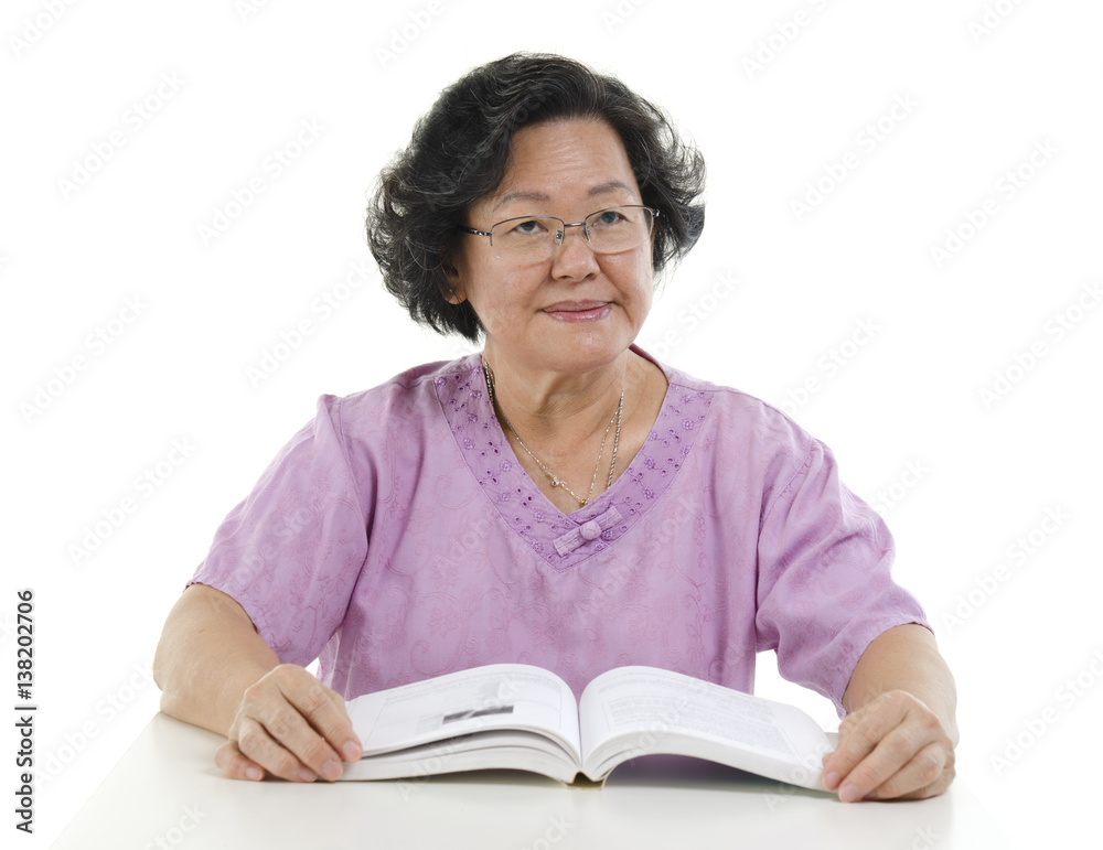 Portrait of Senior adult woman reading book Portrait of Senior adult woman reading book