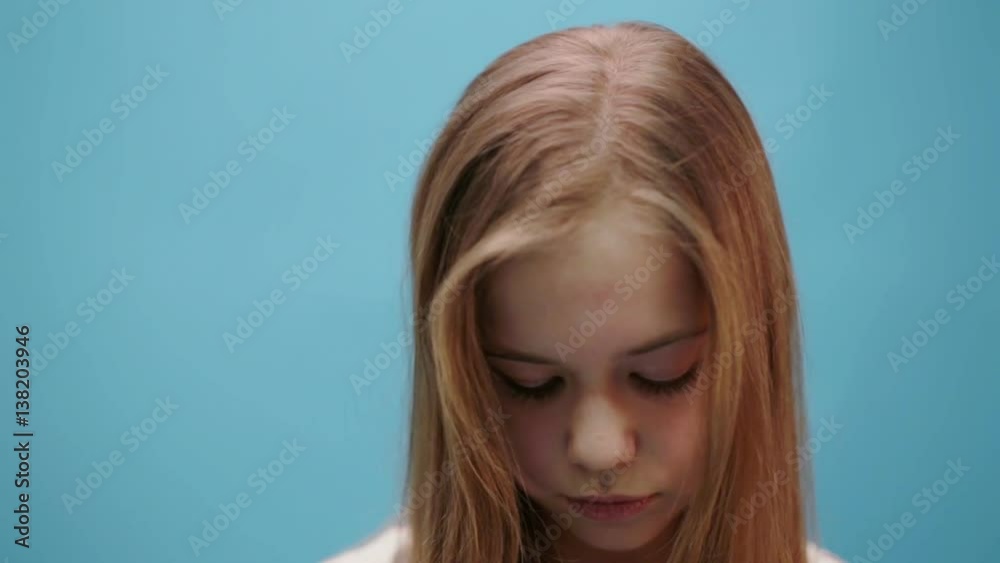 Young girl furrows her eyebrows Young girl furrows her eyebrows