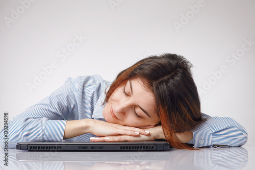 Woman sleeping on the computer