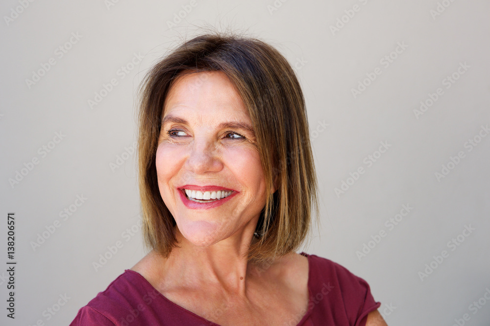 elderly woman laughing and looking away elderly woman laughing and looking away