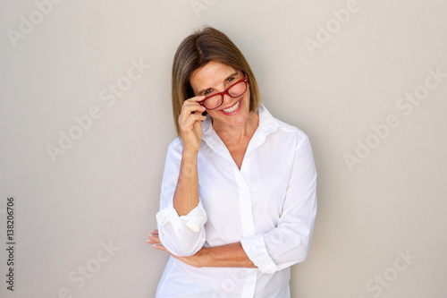 business woman smiling and holding glasses