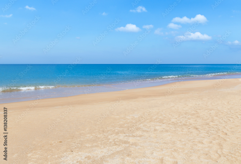white soft wave on empty tropical beach and blue sea 