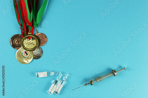 Concept of doping in sport - deprivation medals top view. Place for your text.