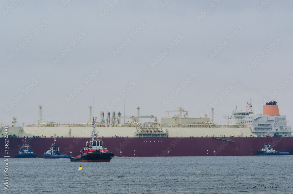 LNG TANKER -  Gas carrier supported by a tug during a maneuver to berth quay in Swinoujscie (Poland)
