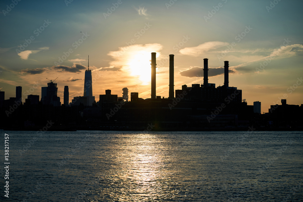 Industrial skyline silhouette from water front