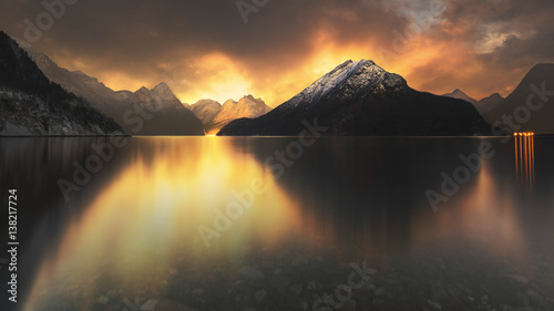 sunset at lake with mountains 