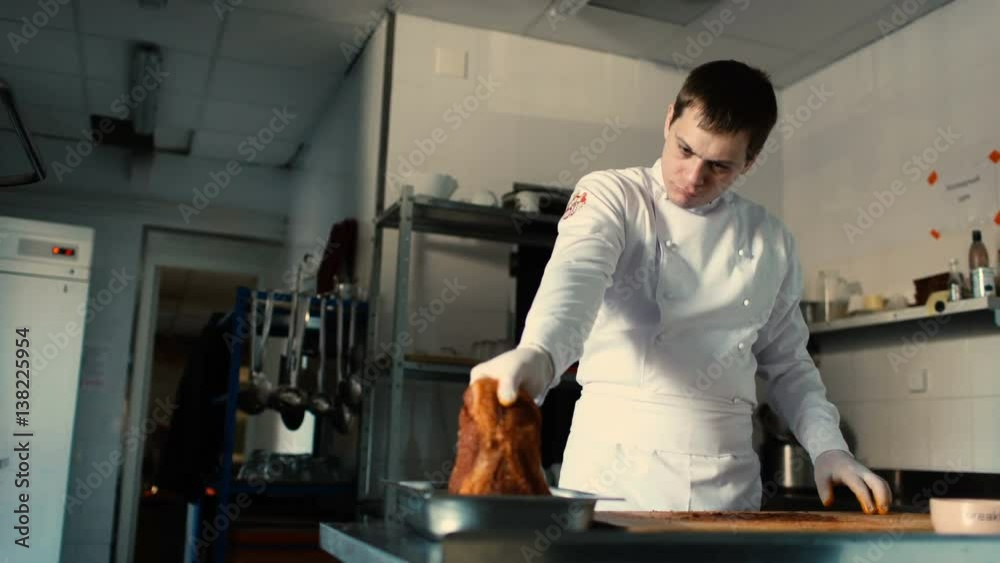 Professional chef man prepare meat ribs with spice on cutting board at restaurant kitchen Professional chef man prepare meat ribs with spice on cutting board at restaurant kitchen