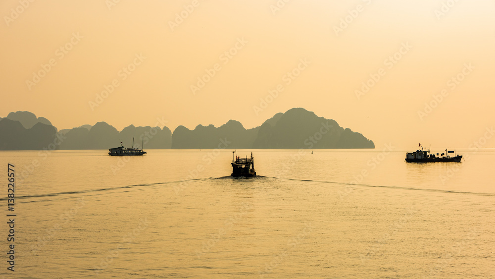 silhouette boat at Halong Bay, Vietnam. Unesco World Heritage Site. Most popular place in Vietnam.