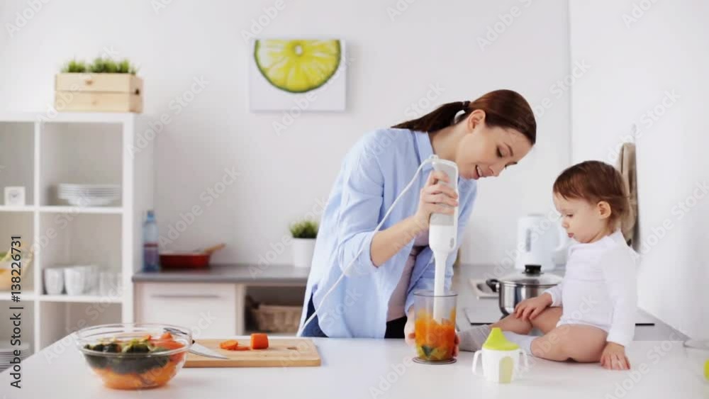 mother with blender cooking baby food at home mother with blender cooking baby food at home