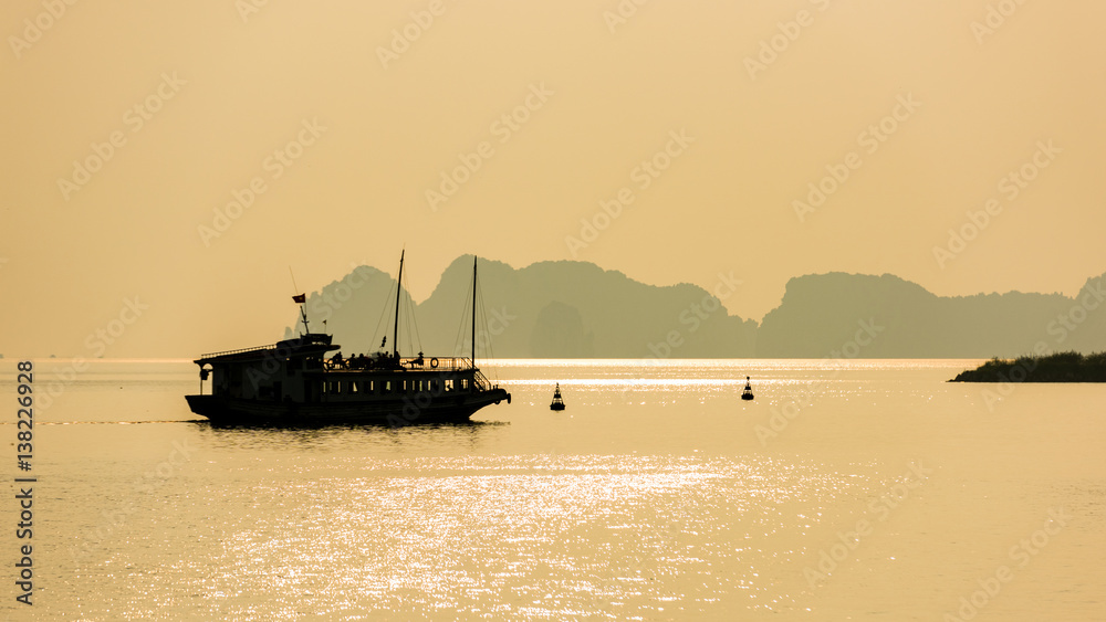 silhouette boat at Halong Bay, Vietnam. Unesco World Heritage Site. Most popular place in Vietnam.