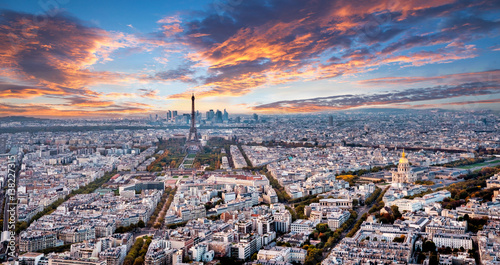 Aerial Paris panorama in late autumn from Montparnasse Tower at sunset. Eiffel Tower in the distance and financial district. © Augustin Lazaroiu