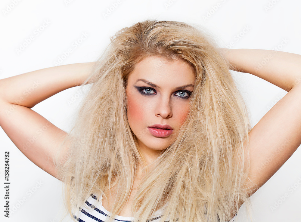 Pretty blonde girl portrait looking at camera Pretty blonde girl portrait looking at camera