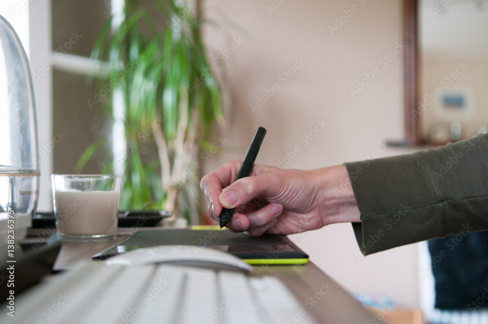 Fototapeta premium Graphic designer using a drawing graphics tablet