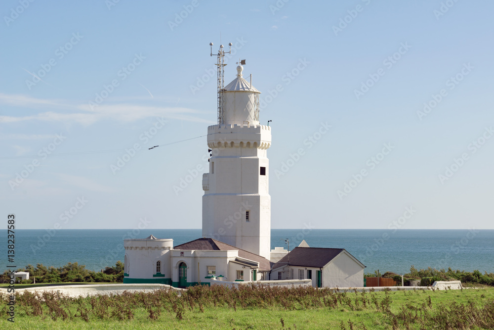 A lighthouse off the Isle of Wight coastline on a warm summer's day A lighthouse off the Isle of Wight coastline on a warm summer's day