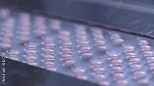 Wallpaper Mural Automated packing at drug production. Closeup slow motion shot of an automated pill packaging machine.Tablets in Packages on a Conveyor. Pharmaceutical machinery for medicine production Pills. Torontodigital.ca