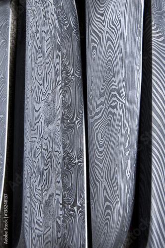 Damascus steel blade of knife. closeup of wootz, blacksmith forging process