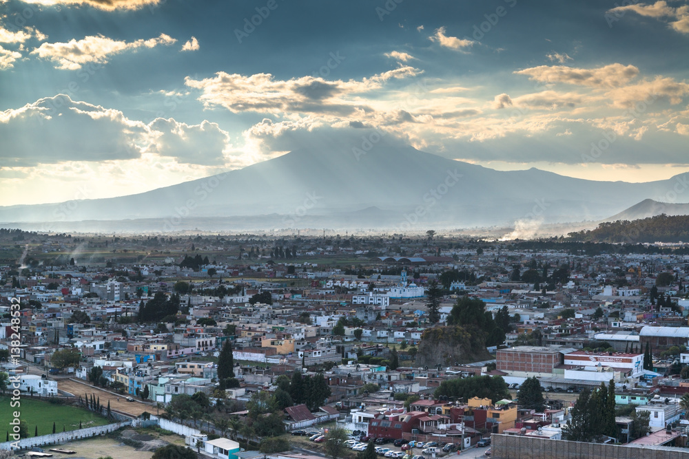 A view of Popocatepetl volcano mountain behind Puebla city