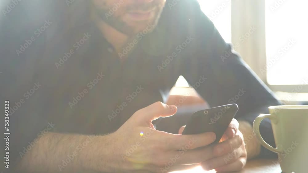 Man using smartphone to text message