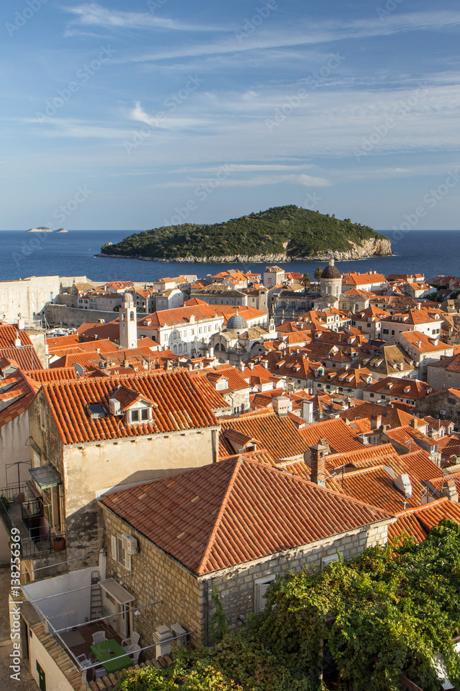 View of homes and red roofs at the historic Old Town in Dubrovnik, Croatia, in the late afternoon.