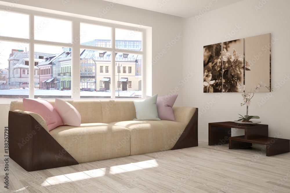 Fototapeta premium White room with sofa and winter landscape in window. Scandinavian interior design